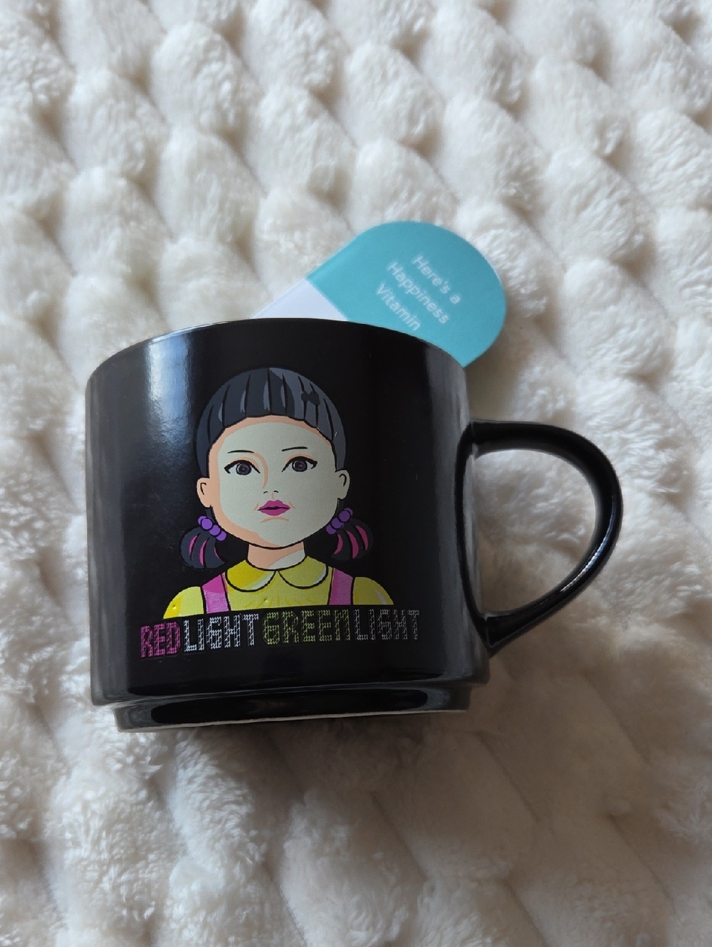 Black Graphic Ceramic Mug with Colorful Doll Illustration